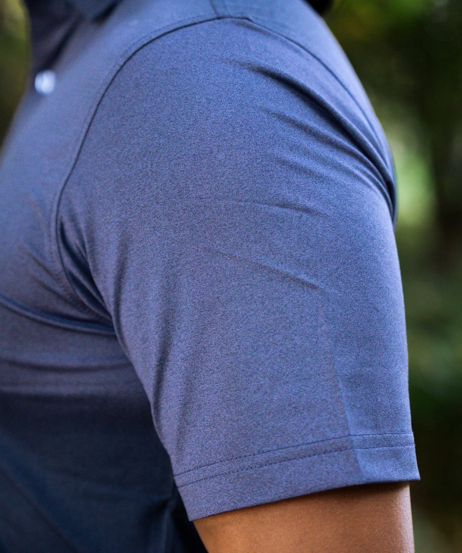 THE HEATHER NAVY PERFORMANCE POLO