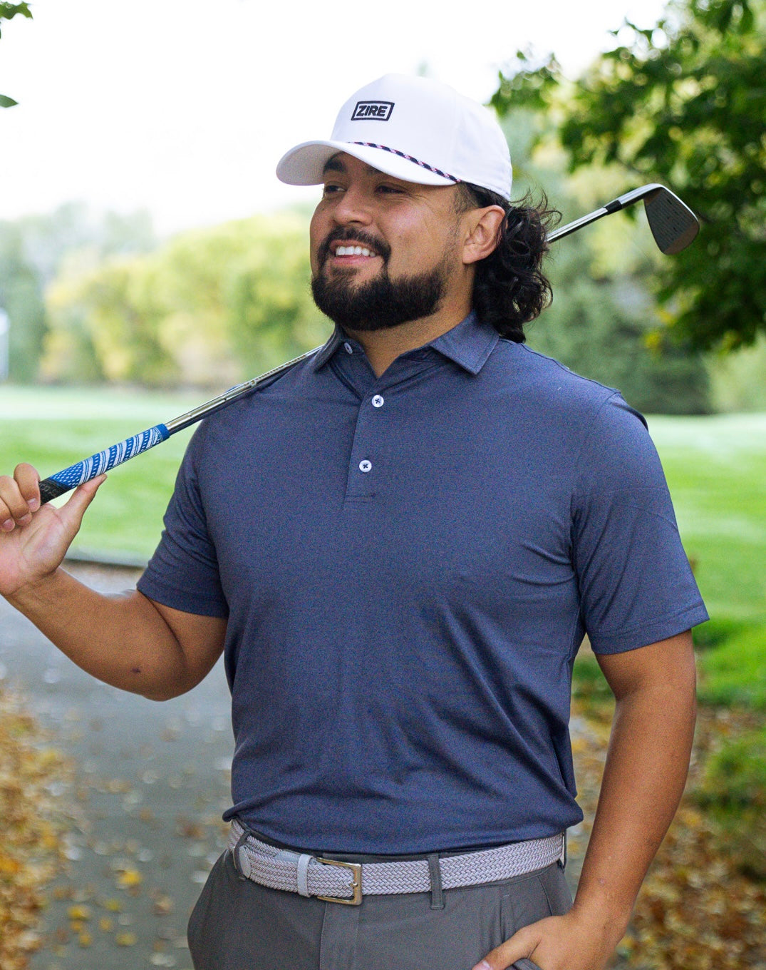 THE HEATHER NAVY PERFORMANCE POLO