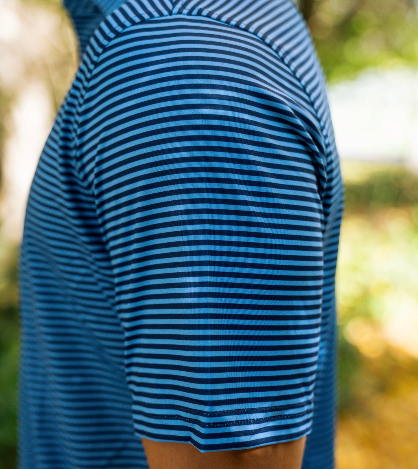 THE BLUE & NAVY STRIPE PERFORMANCE POLO