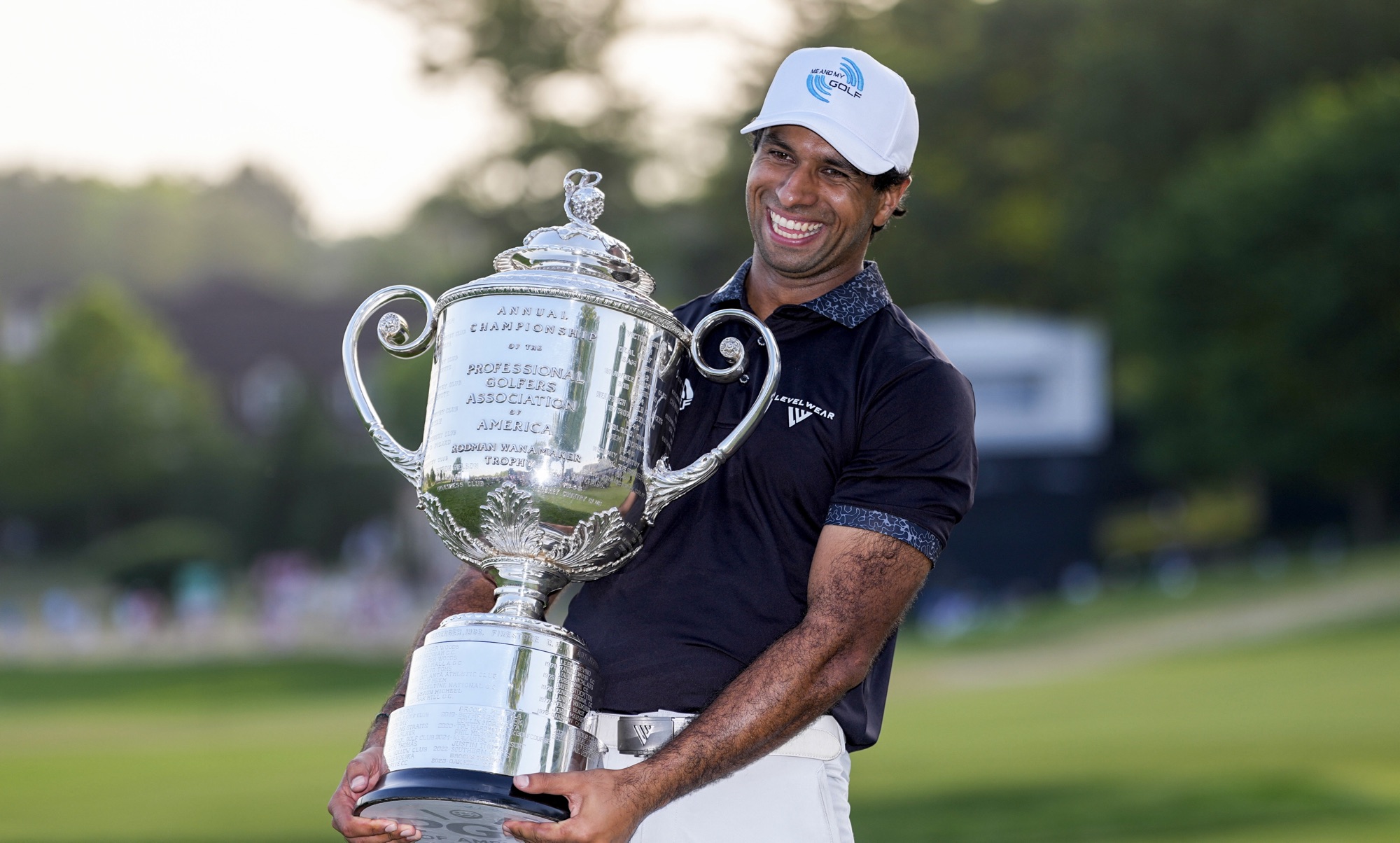 Aaron Rai holds the Wanamaker Trophy after winning the 2026 PGA Championship at Aronimink Golf Club