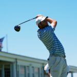 Scottie Scheffler watches his tee shot on the 14th hole during a practice round at the 2026 U.S. Open at Shinnecock Hills