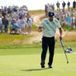 Bryson DeChambeau waves after his putt on the 12th hole during the first round of the U.S. Open golf tournament at Shinnecock Hills Golf Club in Southampton, N.Y., Thursday, June 18, 2026