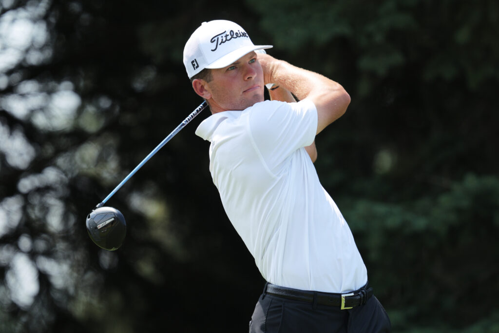 Michael Brennan hits a tee shot at the 3M Open