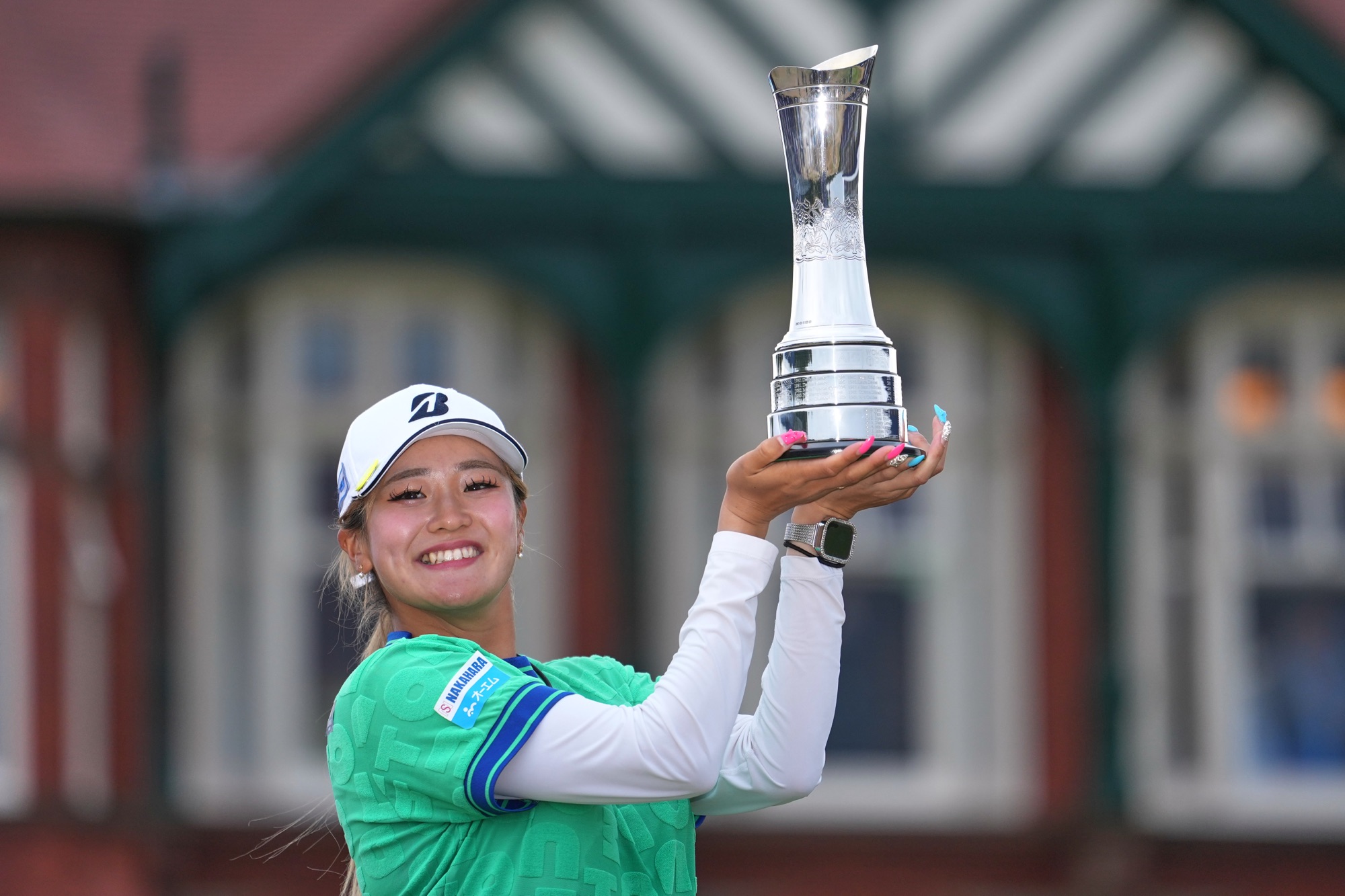 Shiho Kuwaki holds the trophy after winning the AIG Women's Open at Royal Lytham & St Annes