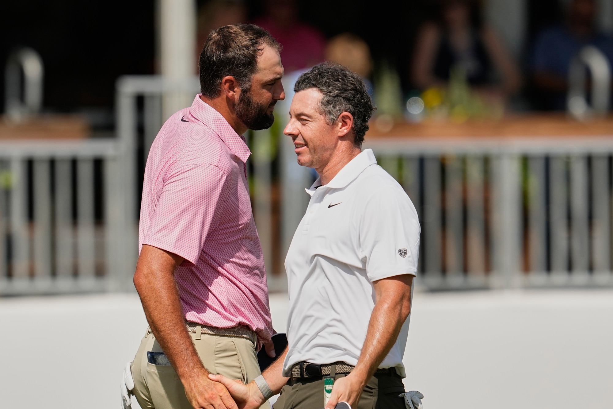 Scottie Scheffler and Rory McIlroy shake hands after the second round of the St. Jude Championship