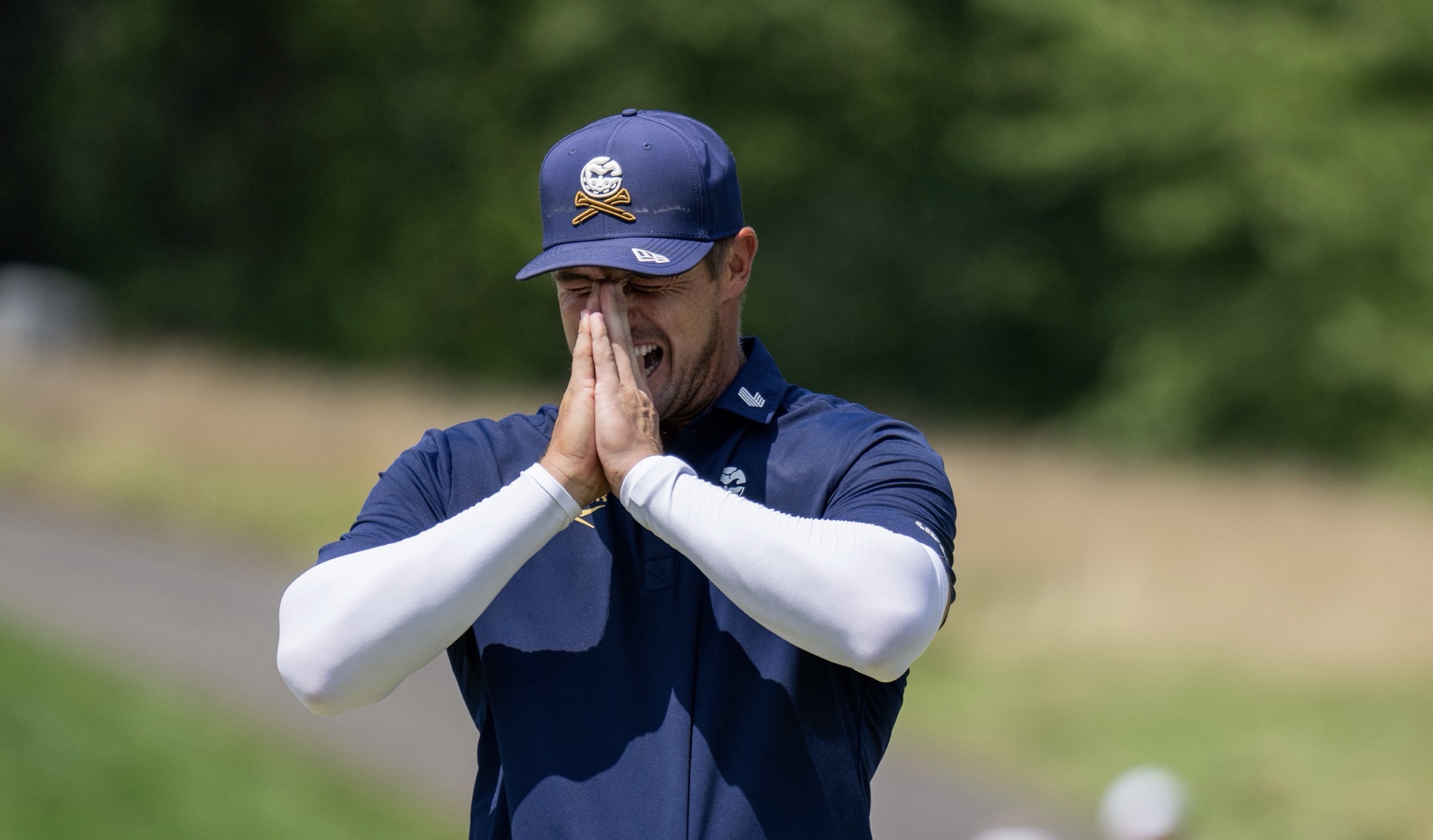 Bryson DeChambeau reacts to a putt during LIV Golf Bedminster