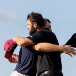 Jon Rahm and Bryson DeChambeau embrace after the final round of LIV Golf Indianapolis at The Club at Chatham Hills