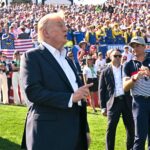 President Donald Trump speaks as U.S. captain Keegan Bradley looks on at the 2025 Ryder Cup at Bethpage Black